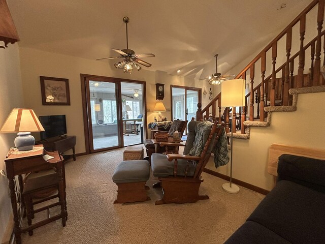 living area featuring carpet floors, a ceiling fan, and baseboards