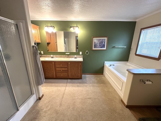 full bath with a sink, carpet floors, a stall shower, and a textured ceiling