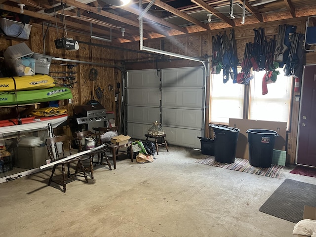 3047 Timberlane Trl, Grayling, MI 49738 - garage featuring a garage door opener