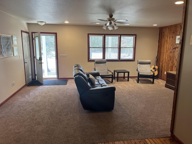 3047 Timberlane Trl, Grayling, MI 49738 - carpeted living room featuring recessed lighting, a ceiling fan, and a textured ceiling