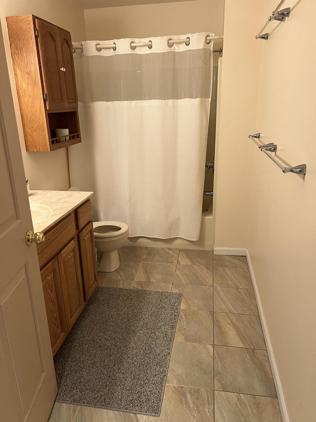 3047 Timberlane Trl, Grayling, MI 49738 - full bath featuring vanity, baseboards, shower / bath combination with curtain, and toilet