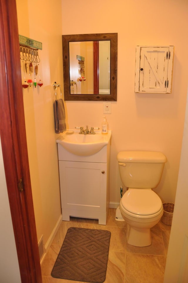 3047 Timberlane Trl, Grayling, MI 49738 - half bath with toilet, baseboards, tile patterned flooring, and vanity