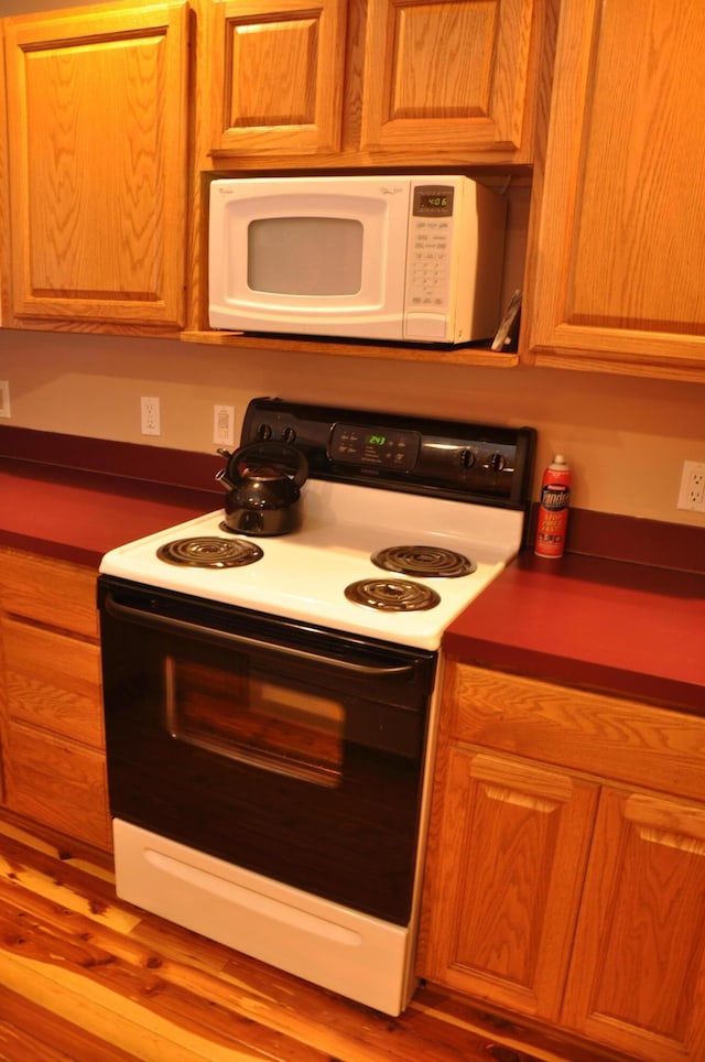 3047 Timberlane Trl, Grayling, MI 49738 - kitchen featuring dark countertops and white appliances