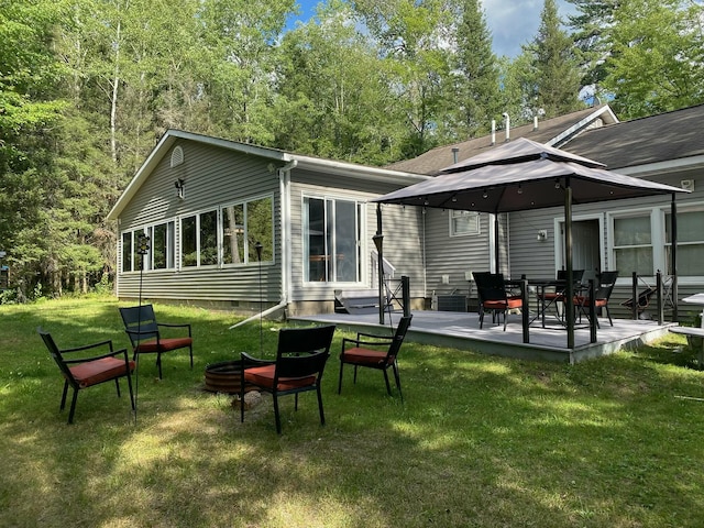 3047 Timberlane Trl, Grayling, MI 49738 - rear view of property featuring entry steps, a patio, a yard, and crawl space