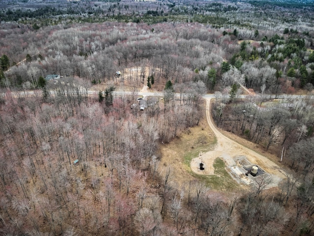 aerial view featuring a wooded view