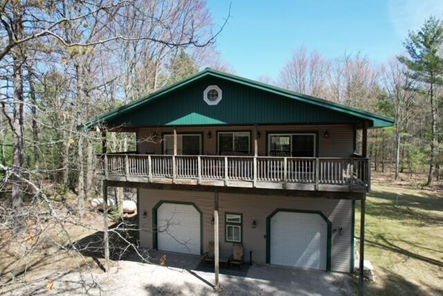 chalet / cabin with an attached garage