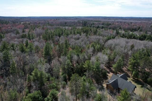 drone / aerial view with a view of trees