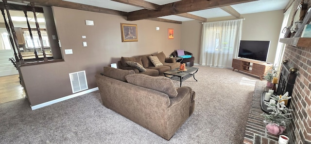 living room with visible vents, a fireplace, beam ceiling, baseboards, and carpet flooring