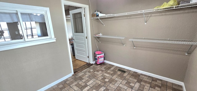 spacious closet with visible vents