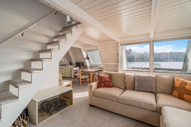 2047 W Martin Lake Rd, Gaylord, MI 49735 - carpeted living room with wood ceiling, beam ceiling, and stairway