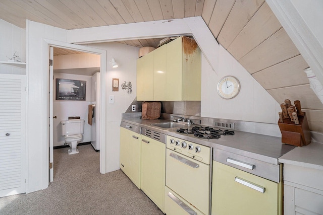 2047 W Martin Lake Rd, Gaylord, MI 49735 - kitchen featuring light carpet, a sink, light countertops, vaulted ceiling with beams, and wood ceiling