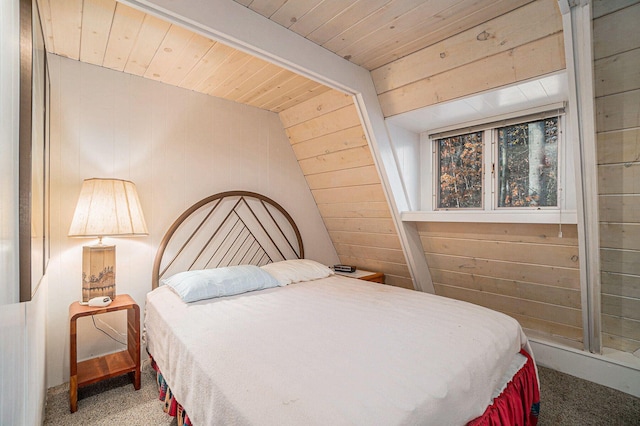 2047 W Martin Lake Rd, Gaylord, MI 49735 - bedroom featuring wooden walls, wood ceiling, and carpet flooring