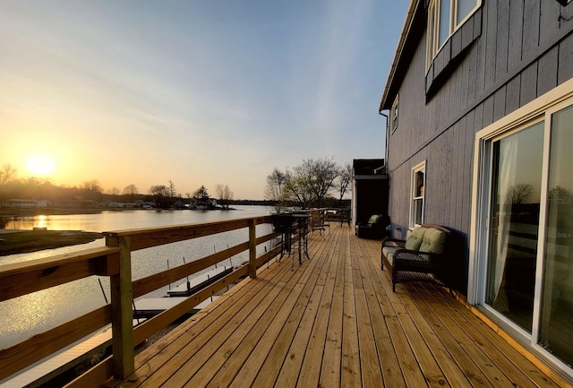 wooden deck featuring a water view