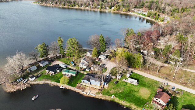 bird's eye view featuring a water view and a residential view