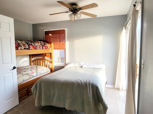 carpeted bedroom featuring a ceiling fan