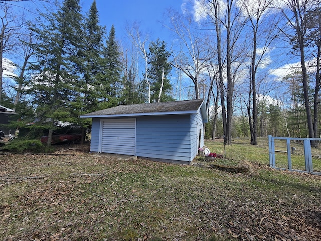 garage featuring a shed