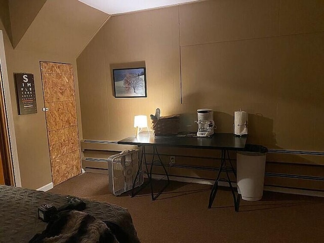 bedroom featuring carpet floors and vaulted ceiling