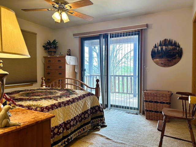 bedroom featuring access to outside, ceiling fan, and light carpet