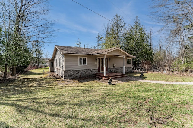 bungalow-style house featuring a shingled roof and a front lawn