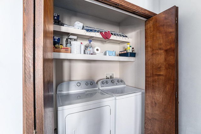 laundry area featuring separate washer and dryer and laundry area