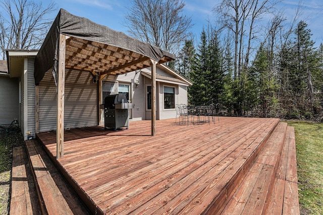 wooden deck featuring outdoor dining area and area for grilling