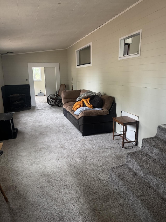 carpeted living area featuring a fireplace