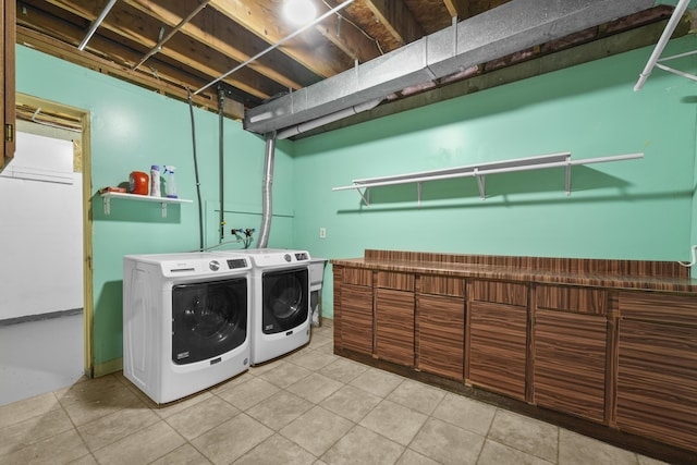 207 Cindy Ave, Roscommon, MI 48653 - laundry area with washer and clothes dryer and light tile patterned floors