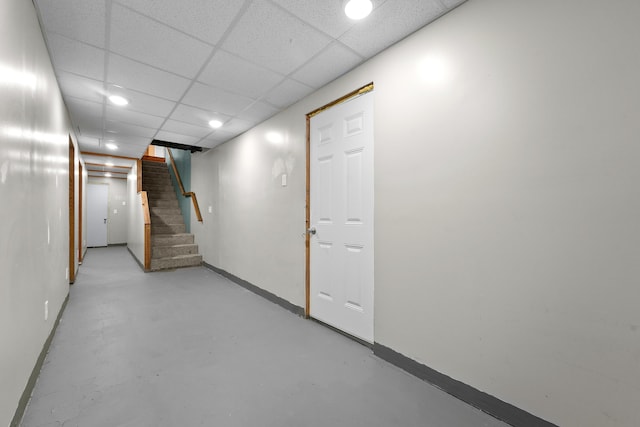 207 Cindy Ave, Roscommon, MI 48653 - finished basement featuring stairway, baseboards, recessed lighting, and a paneled ceiling