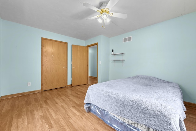 207 Cindy Ave, Roscommon, MI 48653 - bedroom with light wood-style flooring, baseboards, and a ceiling fan