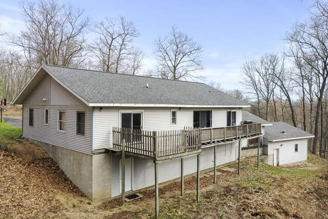 207 Cindy Ave, Roscommon, MI 48653 - back of property with a deck and roof with shingles