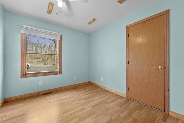 207 Cindy Ave, Roscommon, MI 48653 - unfurnished bedroom featuring light wood-style floors, baseboards, and ceiling fan