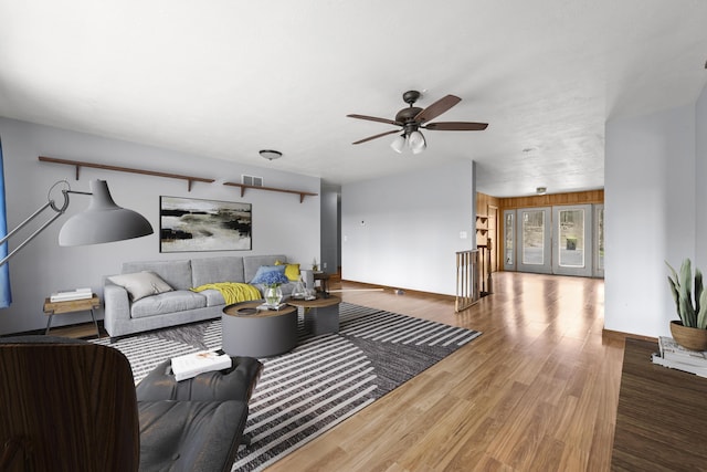 207 Cindy Ave, Roscommon, MI 48653 - living room with a ceiling fan, wood finished floors, and baseboards