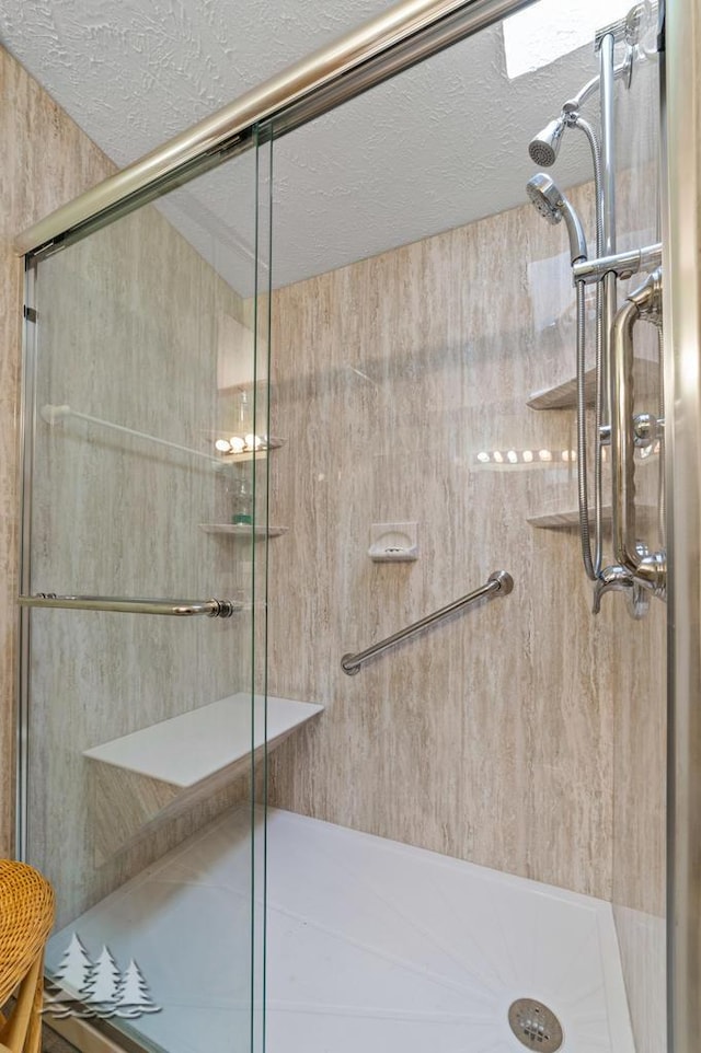 5335 Pinecrest Dr, Lewiston, MI 49756 - bathroom with a textured ceiling and a stall shower