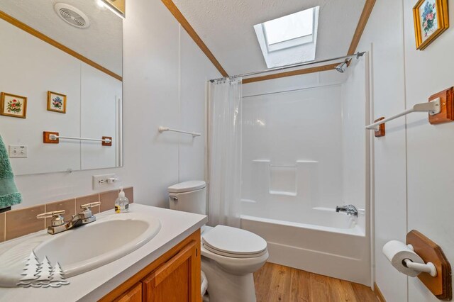 5335 Pinecrest Dr, Lewiston, MI 49756 - full bath with visible vents, shower / bath combination with curtain, wood finished floors, vanity, and toilet