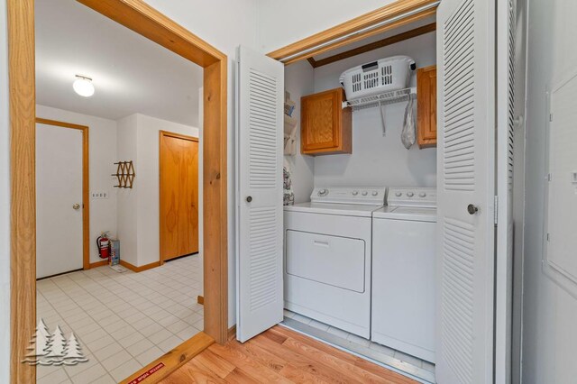 5335 Pinecrest Dr, Lewiston, MI 49756 - washroom featuring independent washer and dryer and cabinet space