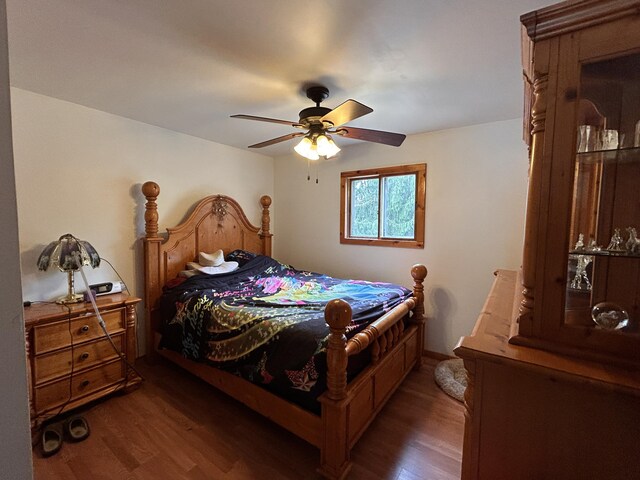 bedroom with ceiling fan and wood finished floors