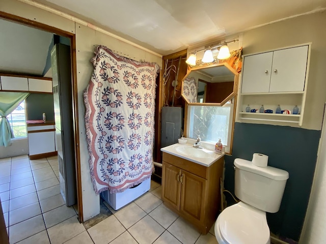 bathroom with vanity, tile patterned flooring, and toilet