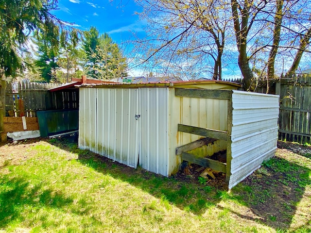 view of shed with fence private yard
