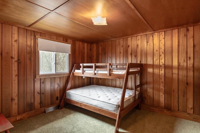 15757 Lakeway Dr, Wolverine, MI 49799 - bedroom featuring visible vents, a sauna, wooden walls, wooden ceiling, and carpet
