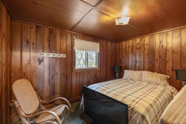 15757 Lakeway Dr, Wolverine, MI 49799 - bedroom with carpet flooring and wood walls