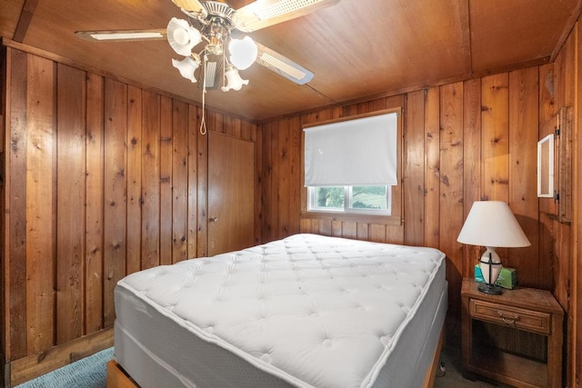 15757 Lakeway Dr, Wolverine, MI 49799 - bedroom featuring a ceiling fan and wooden walls
