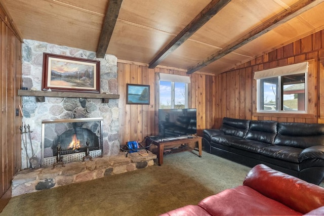 15757 Lakeway Dr, Wolverine, MI 49799 - living area with carpet floors, wooden walls, a wealth of natural light, and vaulted ceiling with beams