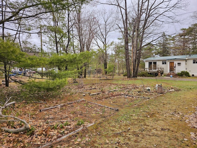 view of yard with a wooden deck