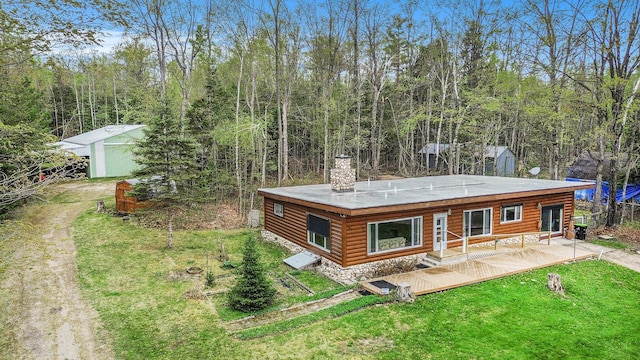3659 N Straits Hwy, Cheboygan, MI 49721 - back of property featuring a yard and a wooden deck