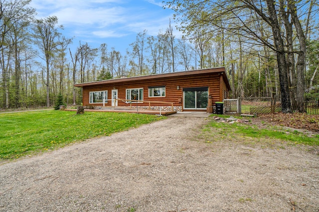3659 N Straits Hwy, Cheboygan, MI 49721 - view of front of property featuring a deck, driveway, and a gate
