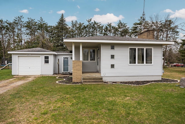 bungalow-style house with a chimney, driveway, an attached garage, and a front yard