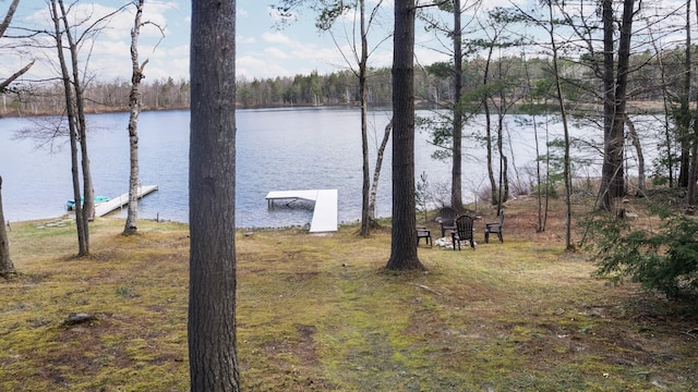 5012 Green Acre Dr, Frederic, MI 49733 - view of yard featuring a water view, a dock, and a forest view