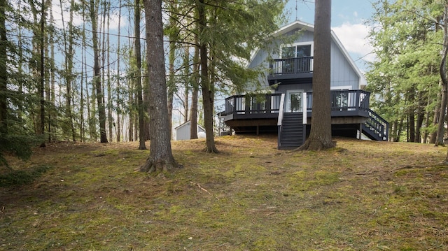 5012 Green Acre Dr, Frederic, MI 49733 - back of property featuring stairs and a wooden deck