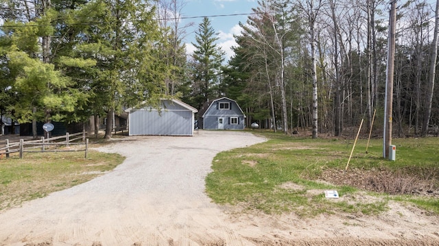 5012 Green Acre Dr, Frederic, MI 49733 - garage with fence and driveway