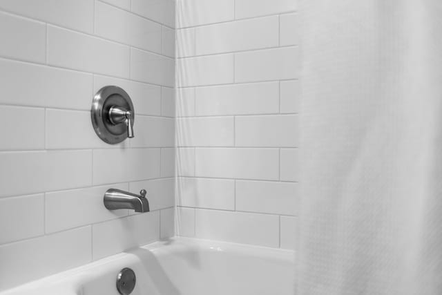 5012 Green Acre Dr, Frederic, MI 49733 - bathroom with a shower with shower curtain and a tub